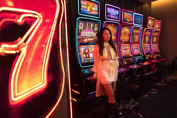 A confident dealer surrounded by casino chips inviting players to access their 778G0 account, reflecting quick and easy login options.